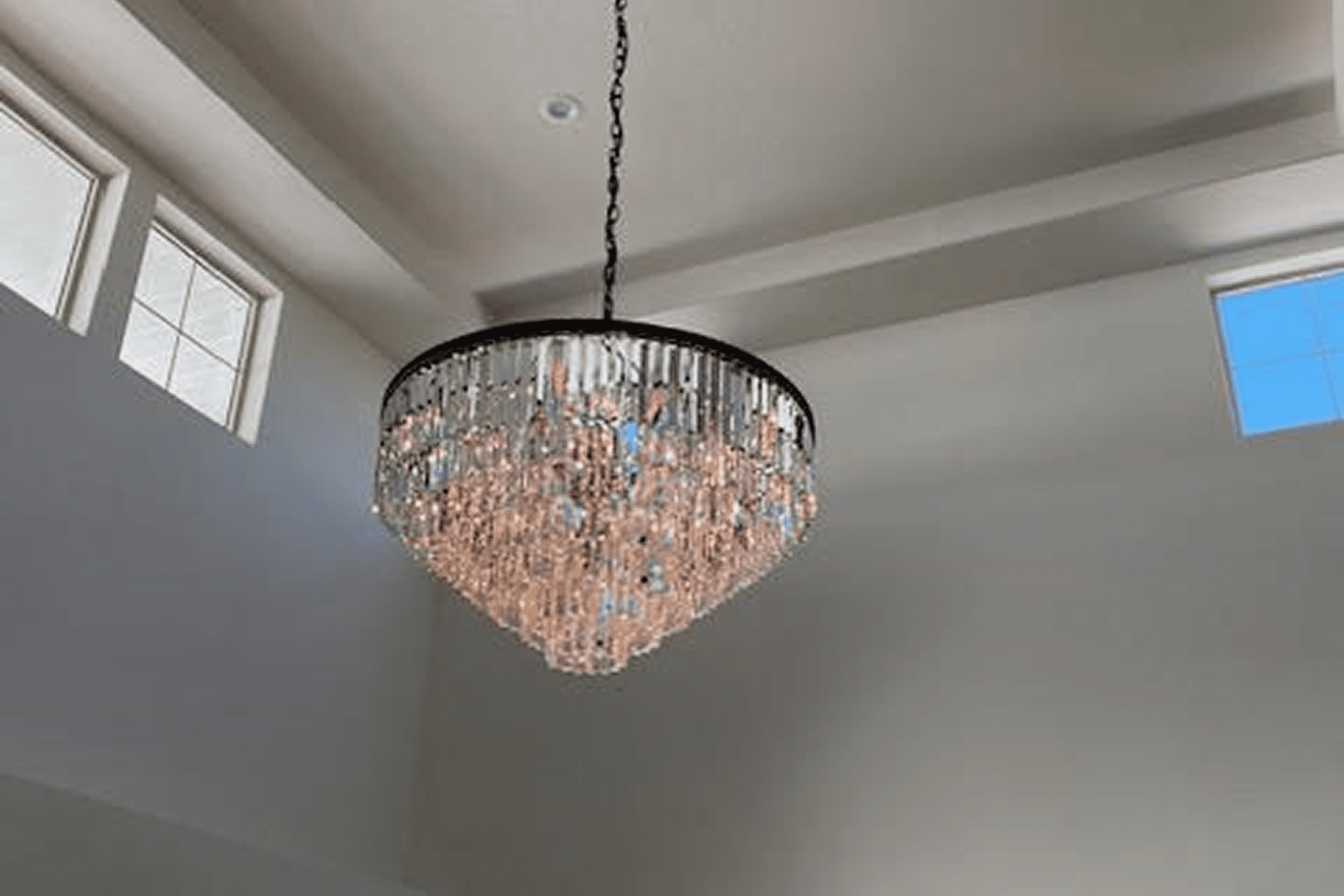 Elegant crystal chandelier hanging from the ceiling.